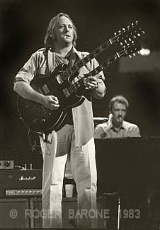 stephen stills playing gibson doubleneck guitar