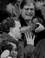 mummers parade fan drinking from boot